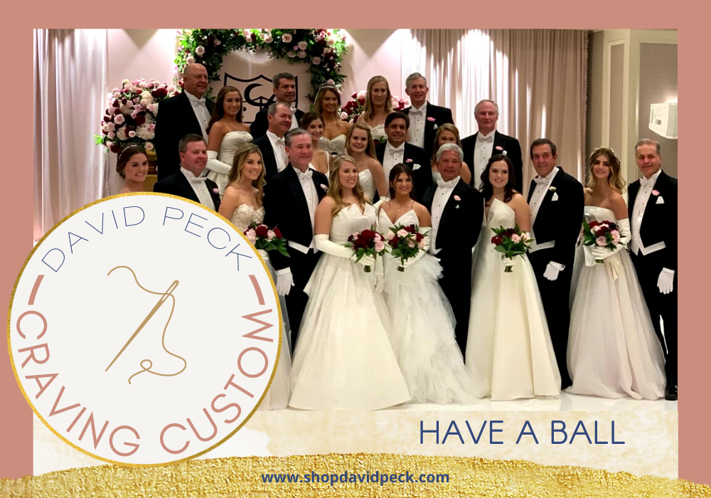 Craving Custom. Girls in white debutante dresses wearing elbow length white satin gloves holding a bouquet of pink and red flowers standing next to their fathers in a line.