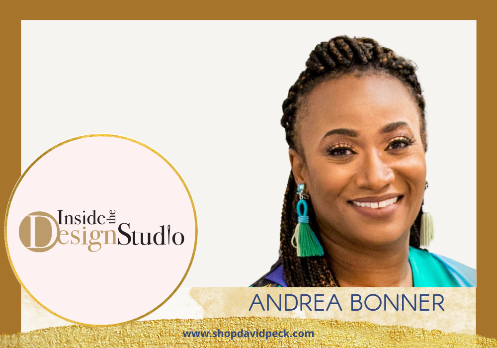 Inside the Design Studio. Smiling African American woman wearing turquoise jewelry and a blouse in front of white background.