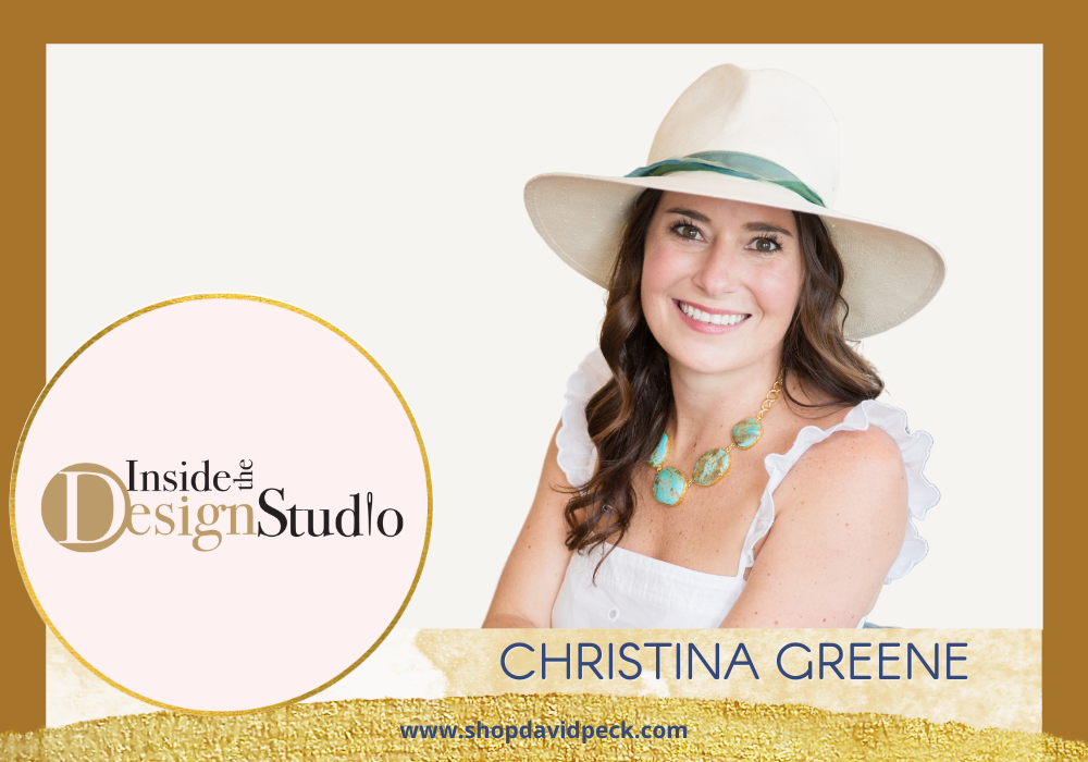 Inside the Design Studio.brunette woman with hat, turquoise jewelry, and white dress smiling with white table in background.