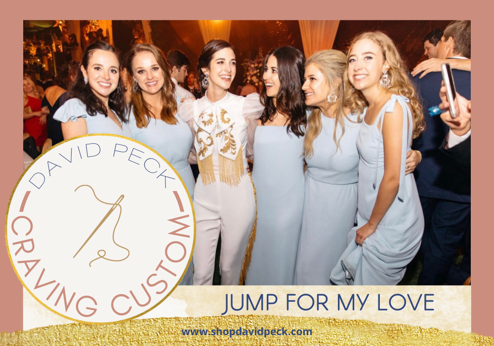 craving custom. bridesmaids in blue dresses and bride wearing mariachi style jumpsuit in white