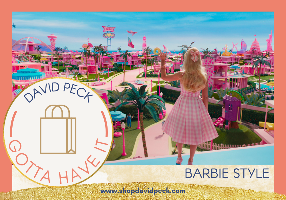 Barbie looking out at Barbieland in a pink gingham dress