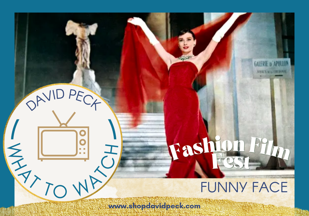Picture of Audrey Hebburn in a red gown at the Louvre in Funny Face