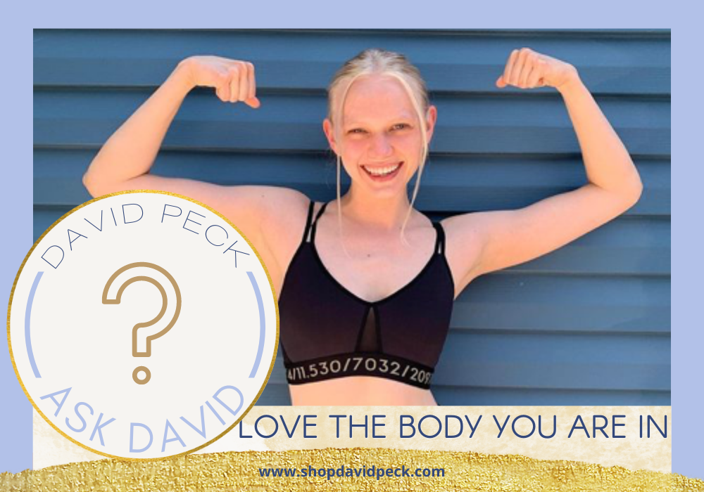 Ask David. Katie moore a blonde Girl in black sports bra flexing her biceps showing strength