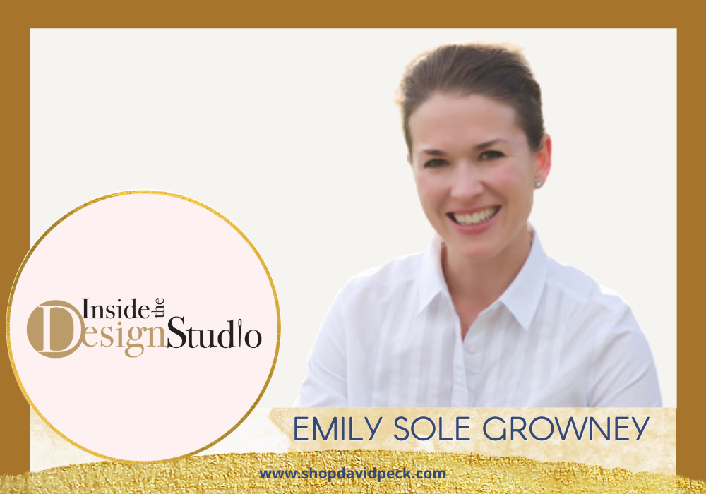 Inside the design studio. Brunette woman in white button down blouse smiling.