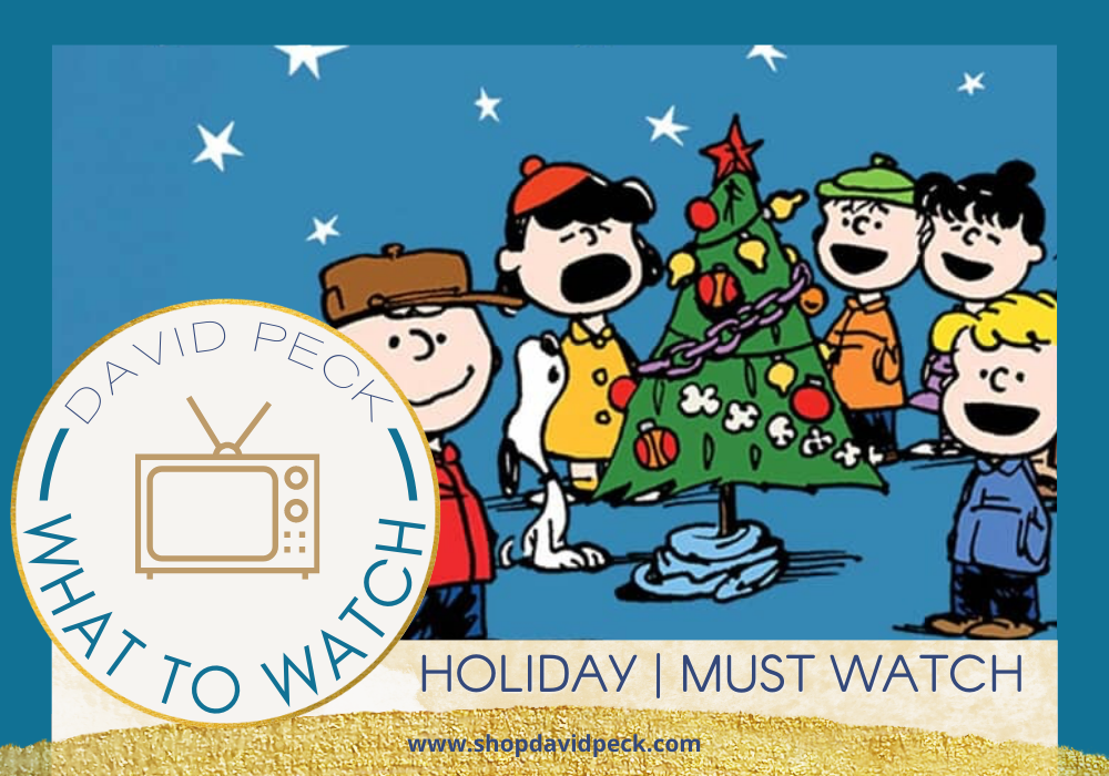what to watch. holiday movie must watch. a charlie brown christmas. all the charlie brown characters singing around a Christmas tree.