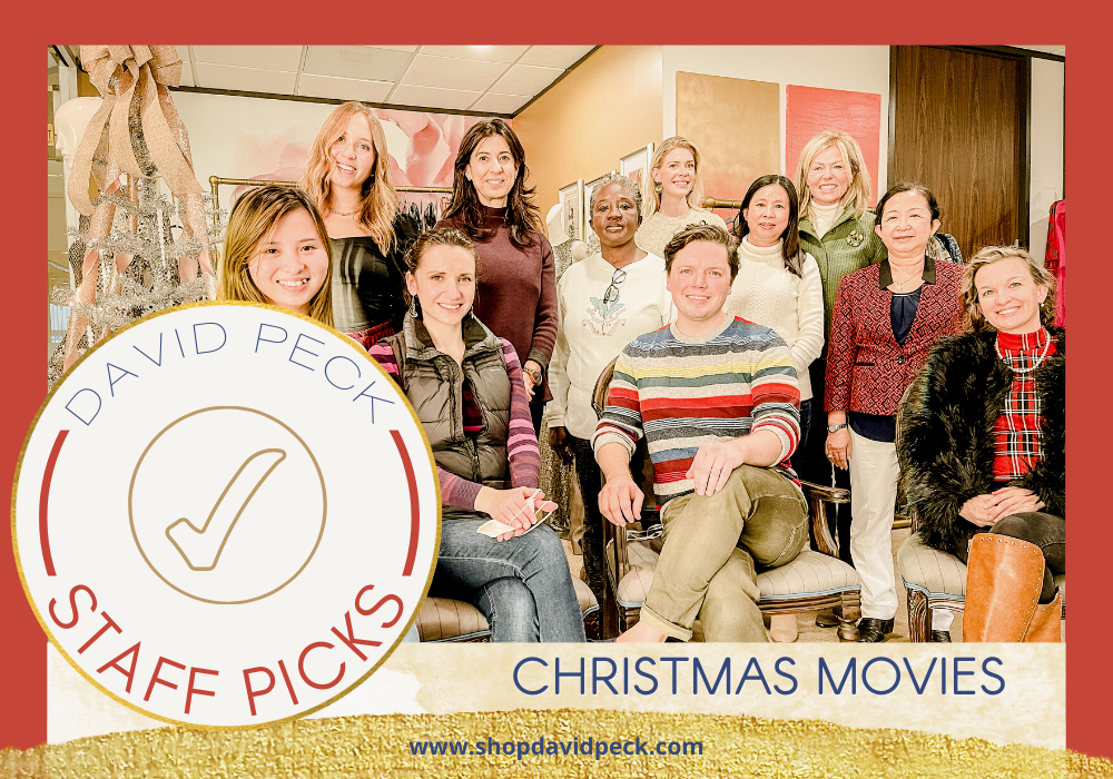 staff picks. david peck staff some sitting and standing all smiling for holiday card.