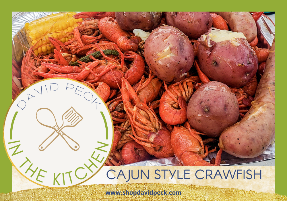 In the kitchen. cajun style red crawfish, yellow corn, and red potatoes in aluminum pan