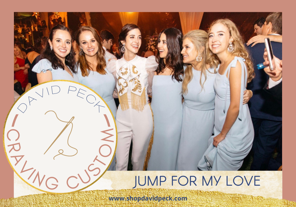 craving custom. bridesmaids in blue dresses and bride wearing mariachi style jumpsuit in white 