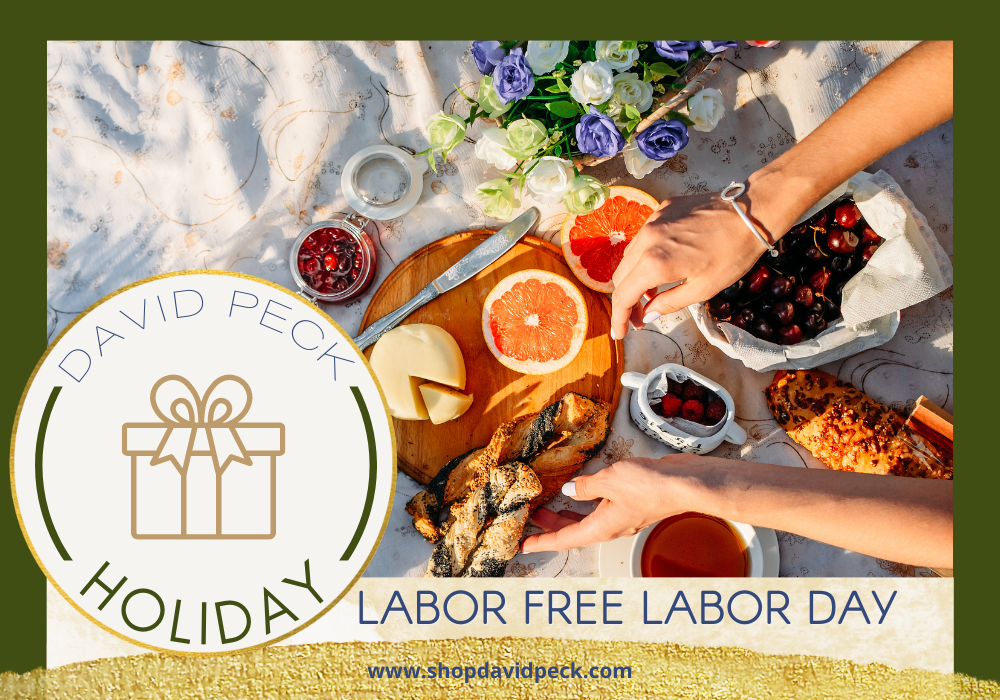 holiday. labor day 2020. hands reaching for a charcuterie board on white blanket.