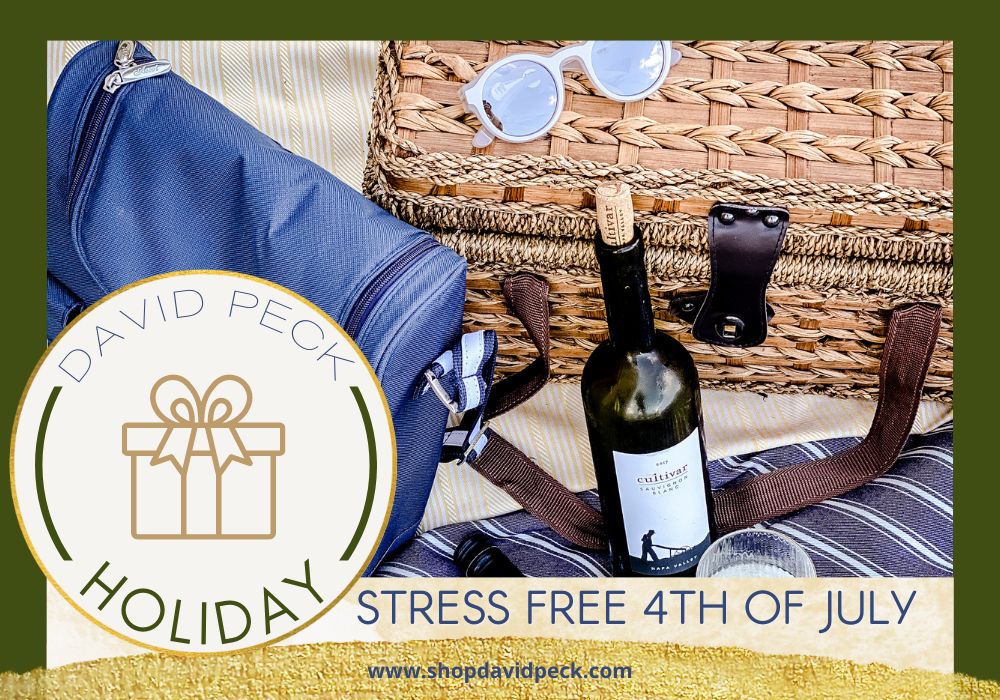 holiday. Stress Free 4th of July Celebration Ideas During Quarantine with David Peck. picnic basket, glasses, bottles of wine, and wine carrier sit on a custom david peck picnic blanket