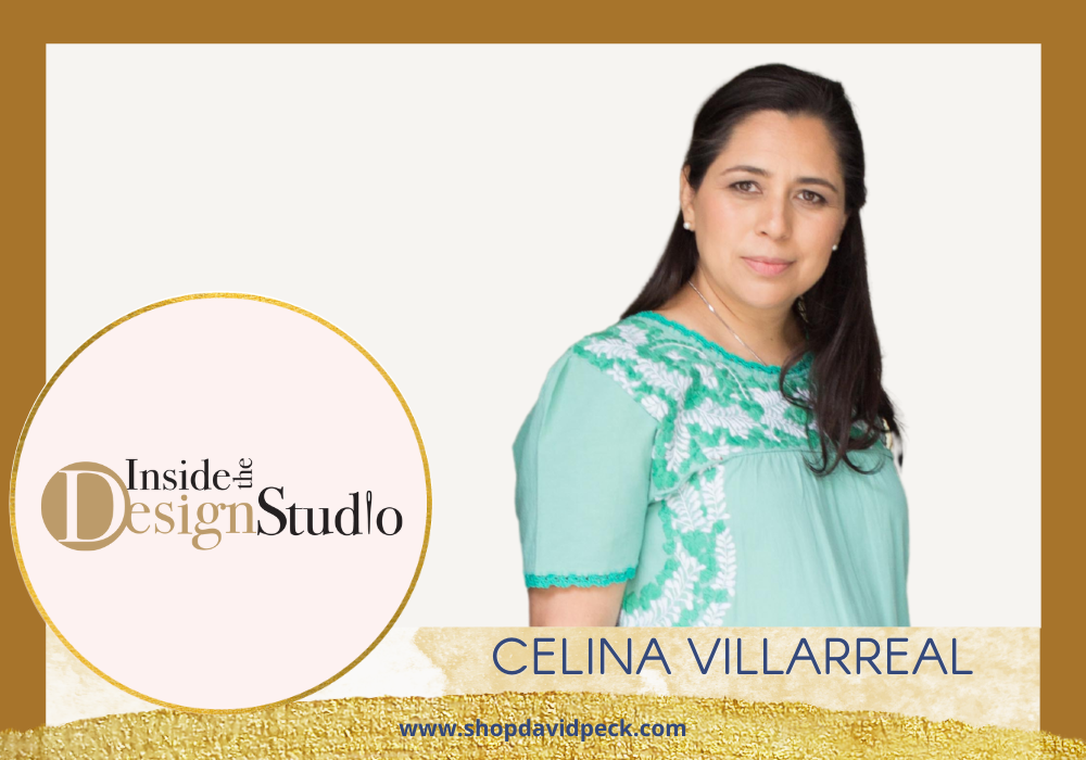 Inside the design studio. Dark hair latin Woman Celina Villarreal wearing her teal dress with Mexican embroidery from Margarita Mercantile.