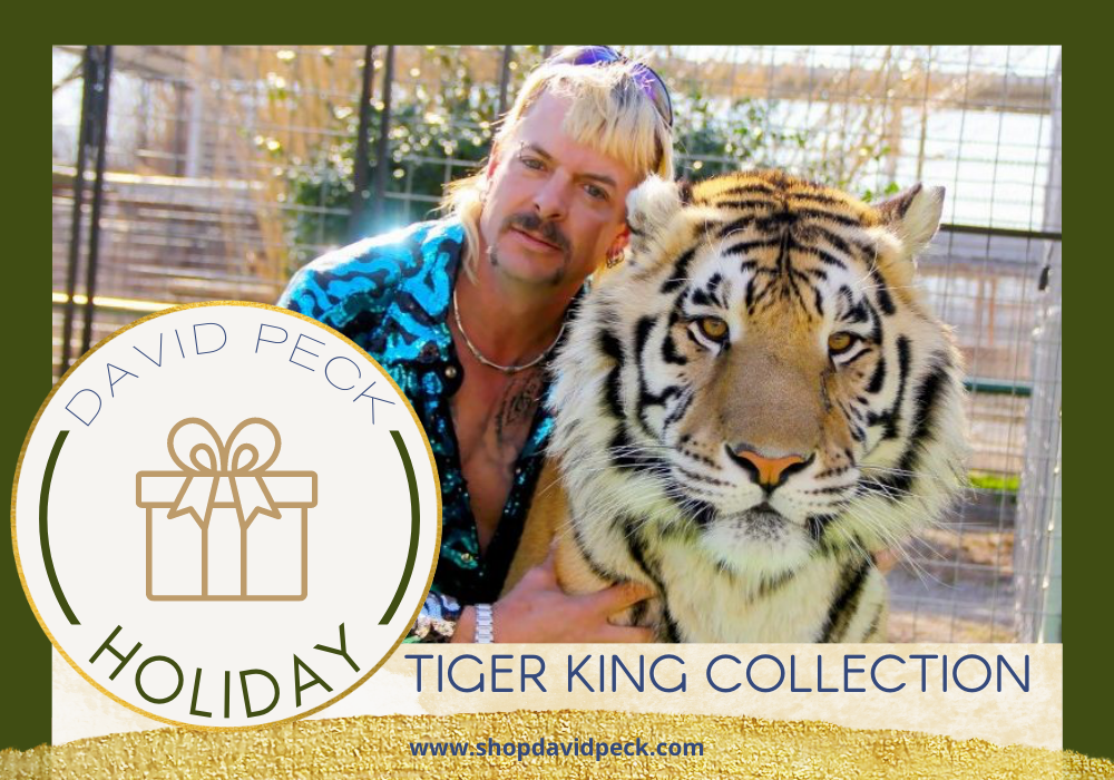 Holiday. Joe exotic form Tiger King hugging adult female tiger in a blue and purple sequin tiger print top