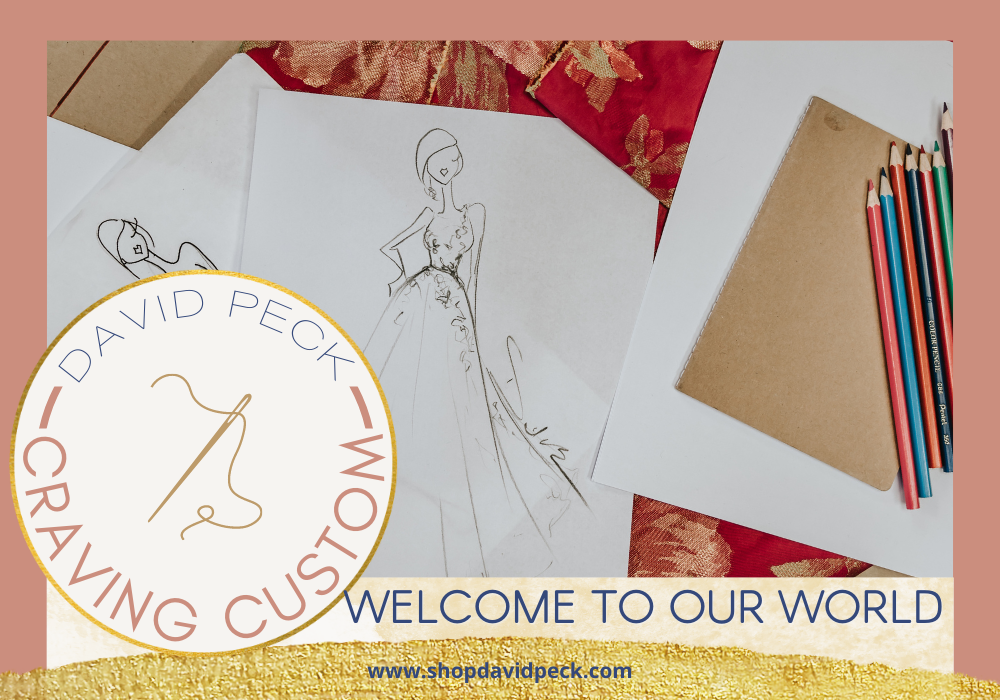 craving custom. garment sketches, red fabric, and colored pencils sit on top of a table