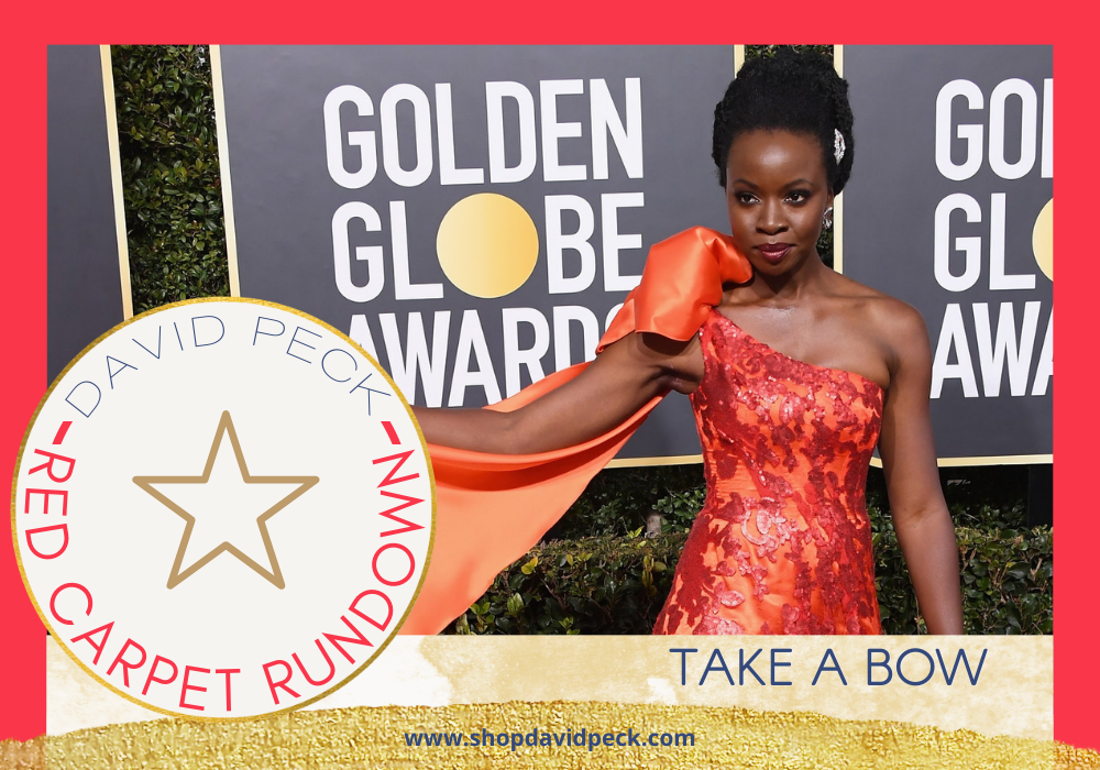 Red Carpet Rundown. African American woman wearing sequin detailed red and orange one shoulder dress at the Golden Globe Awards. 
