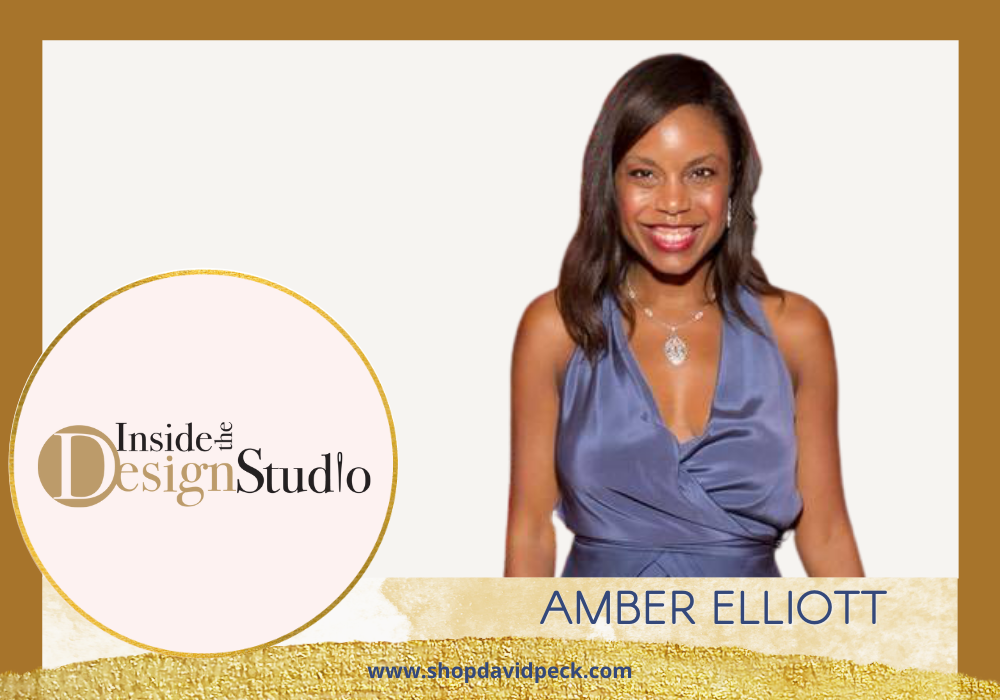 Inside the Design Studio. Smiling African American woman in blue satin vneck dress.