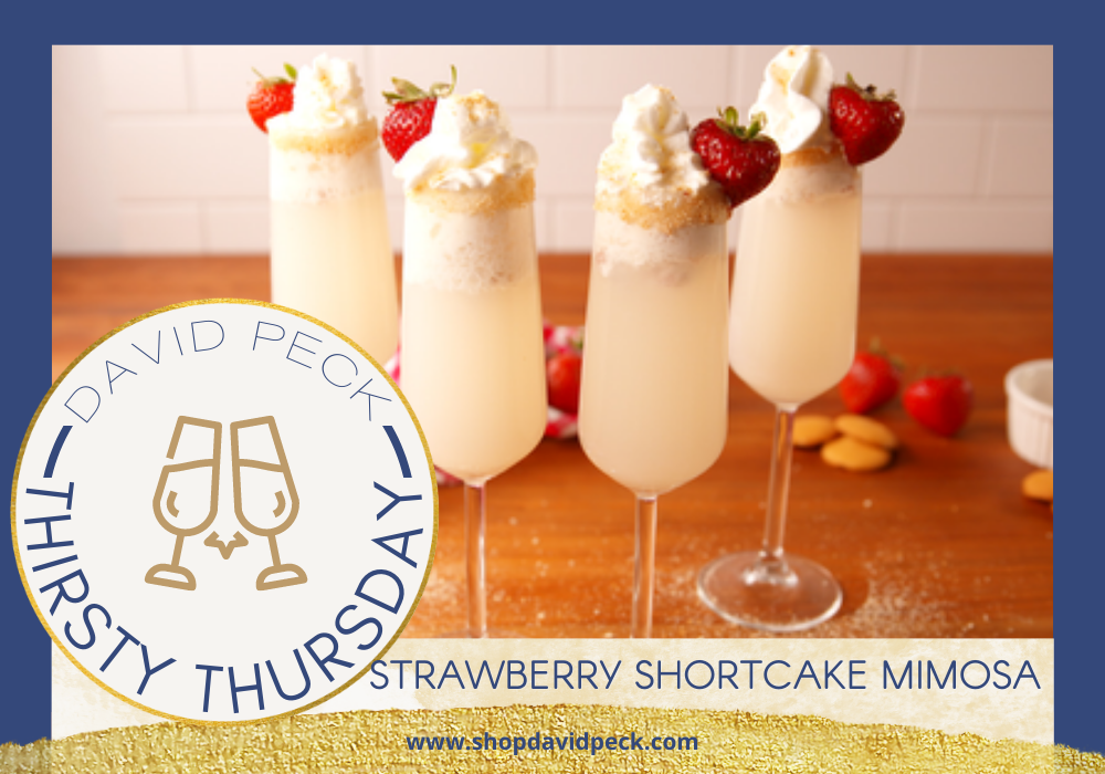 thirsty Thursday.  Champagne flutes with prosecco, vanilla vodka, nilla wafers, strawberries, and whipped cream on a countertop