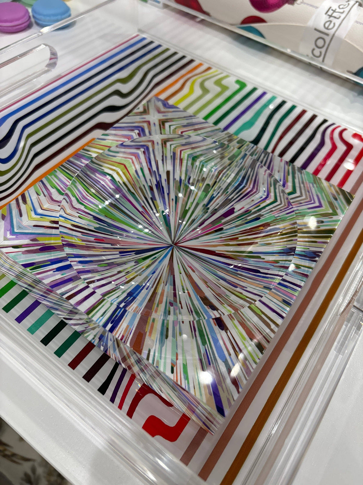 Colorful abstract design on a clear plastic sheet with a white background