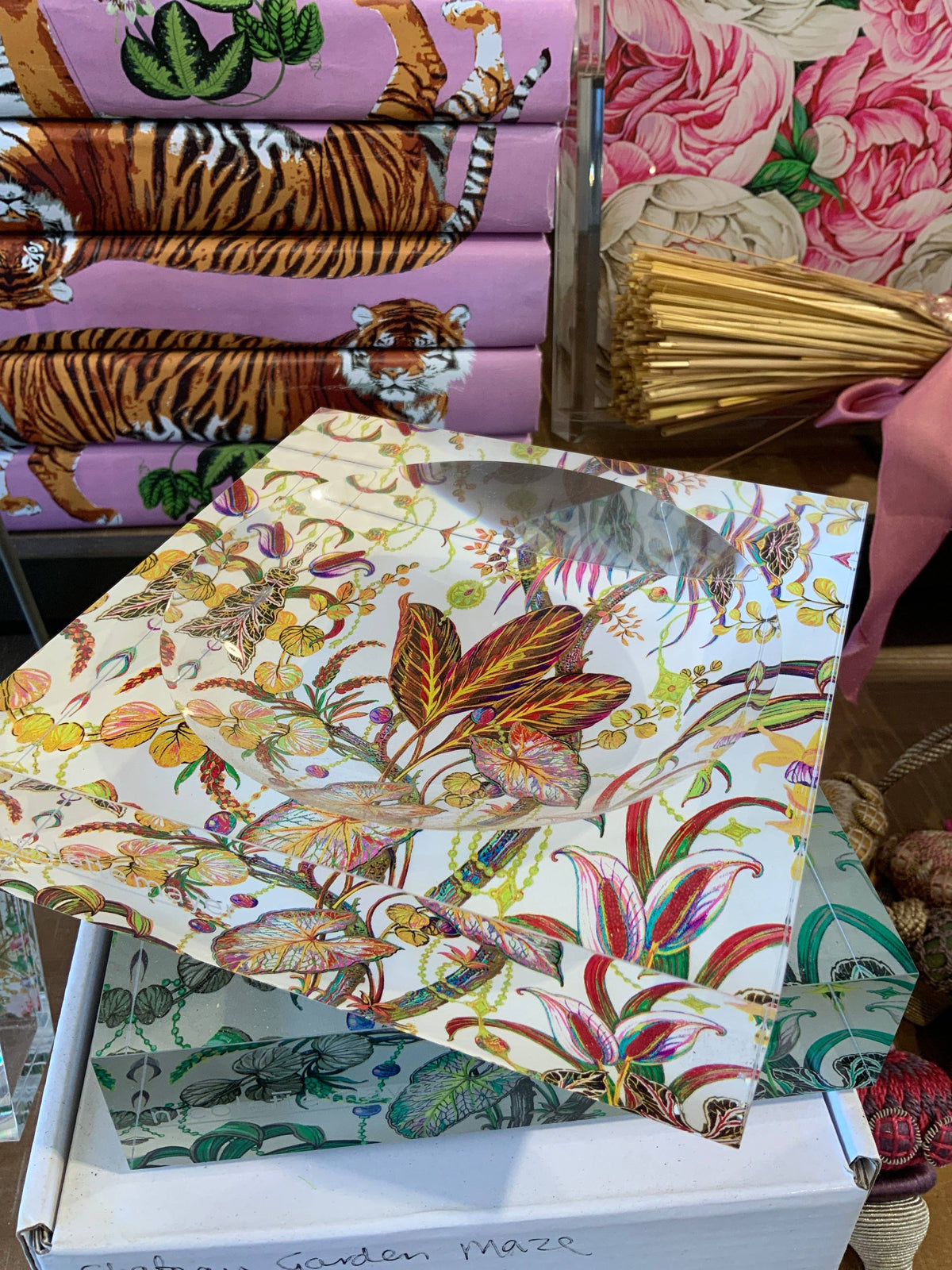 Collection of colorful fabric swatches with floral and animal patterns.